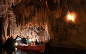 Exploring Hidden Valley Cave in a canoe in Belize.