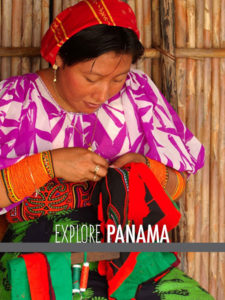 A Panamanian woman sews.